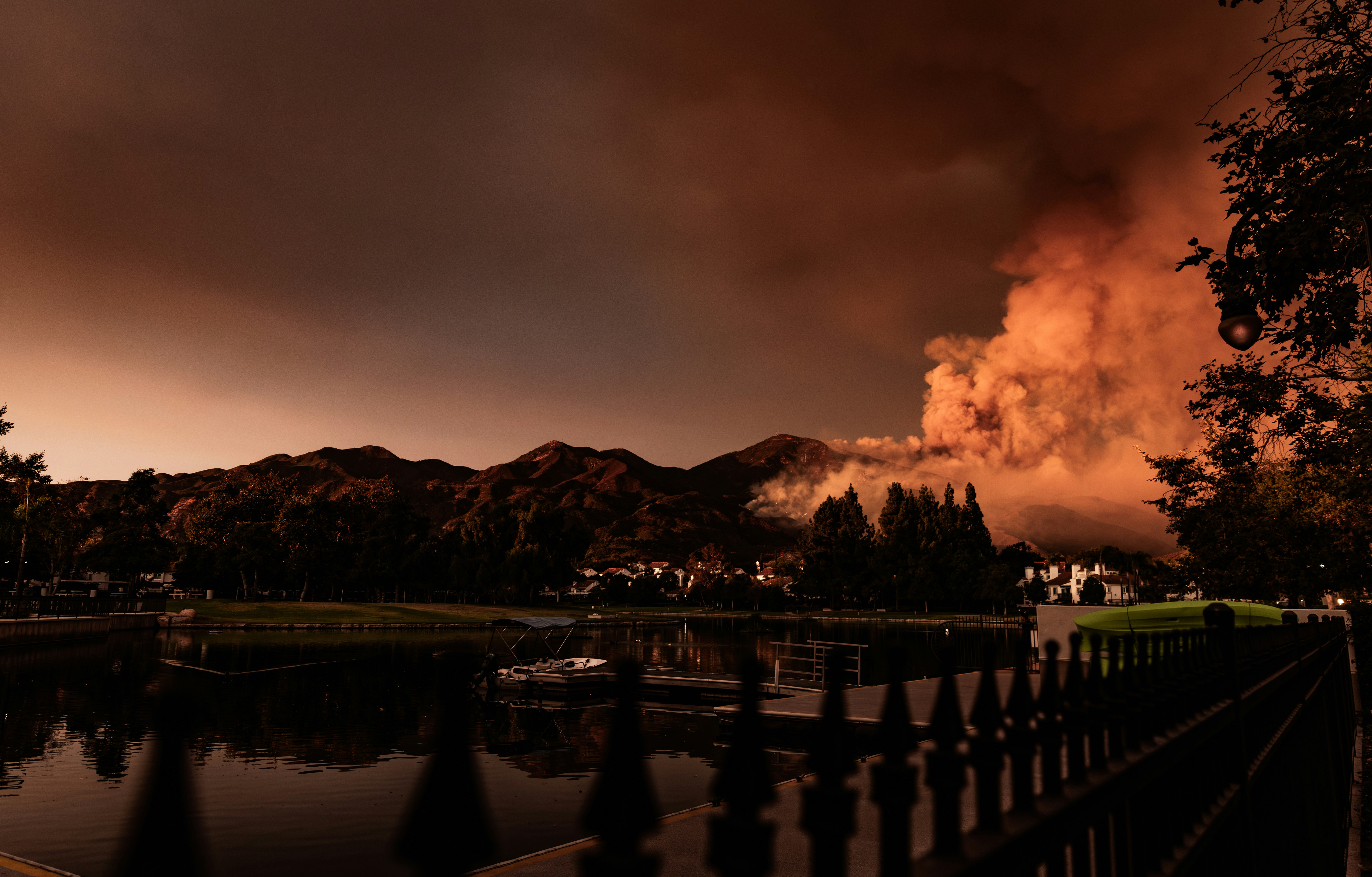 A large plume of smoke is seen in the distance