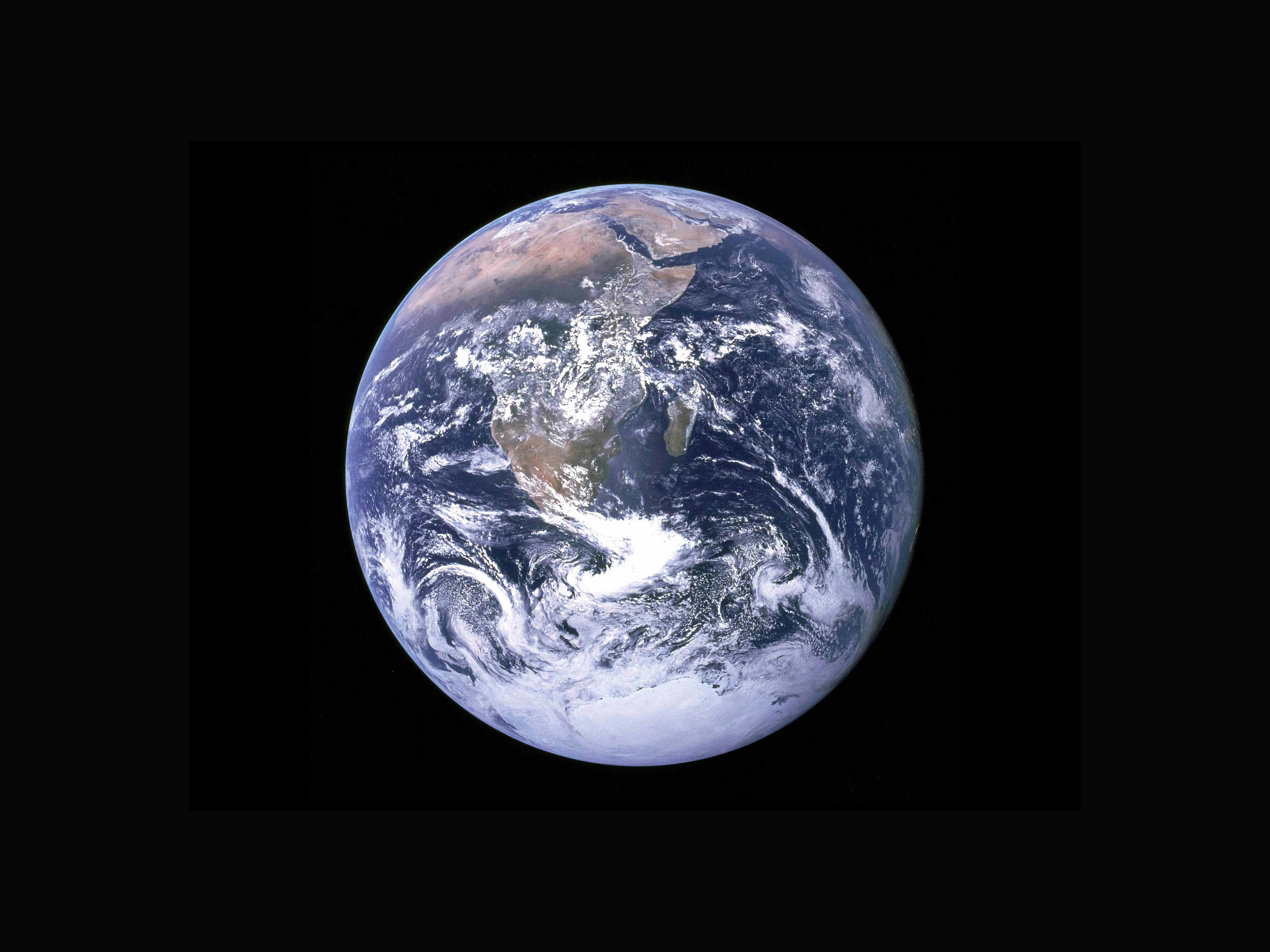 A smartphone showing incoming text messages with a small globe icon and question marks, representing confused customer inquiries after a viral claim.
